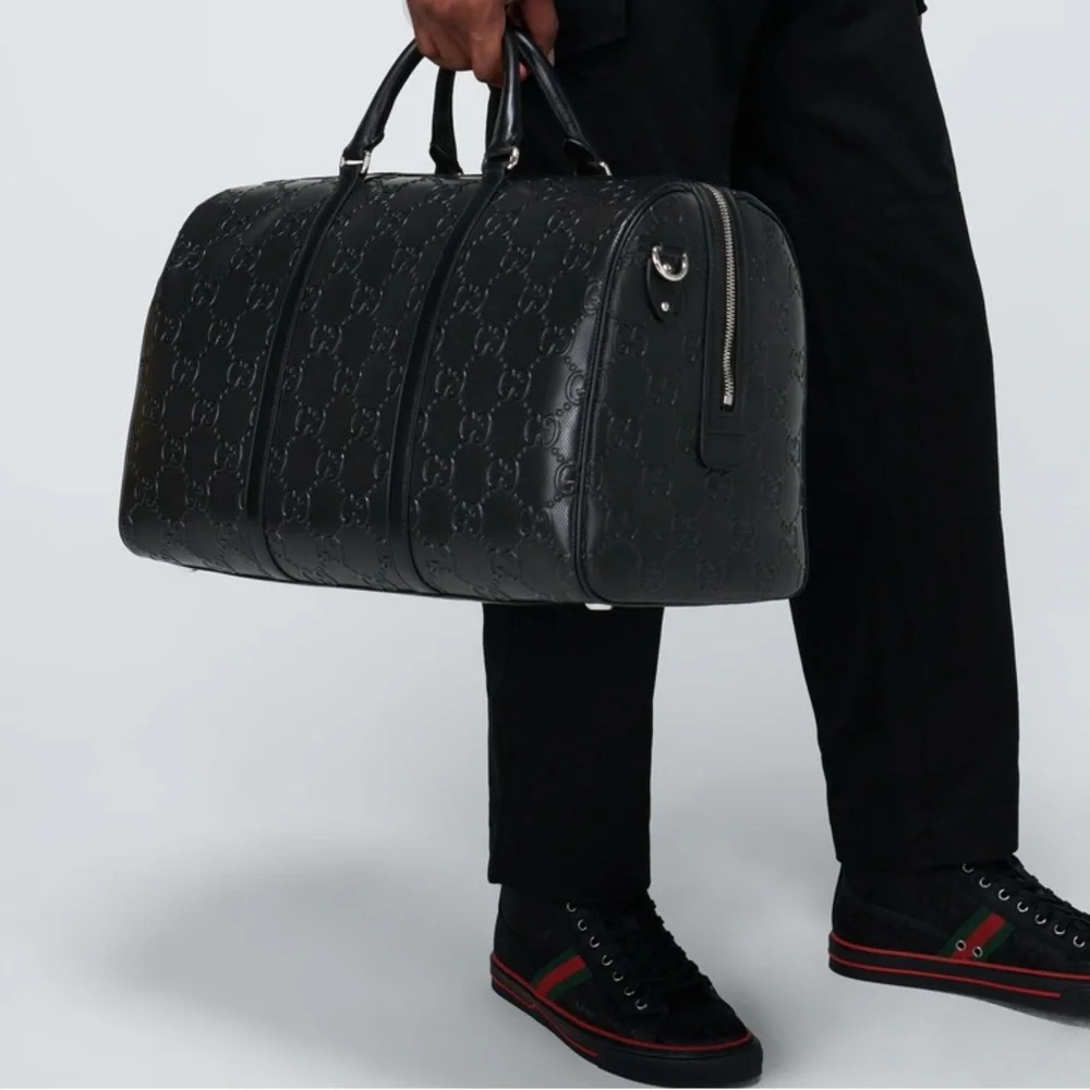 New! Gucci GG embossed black leather duffel bag